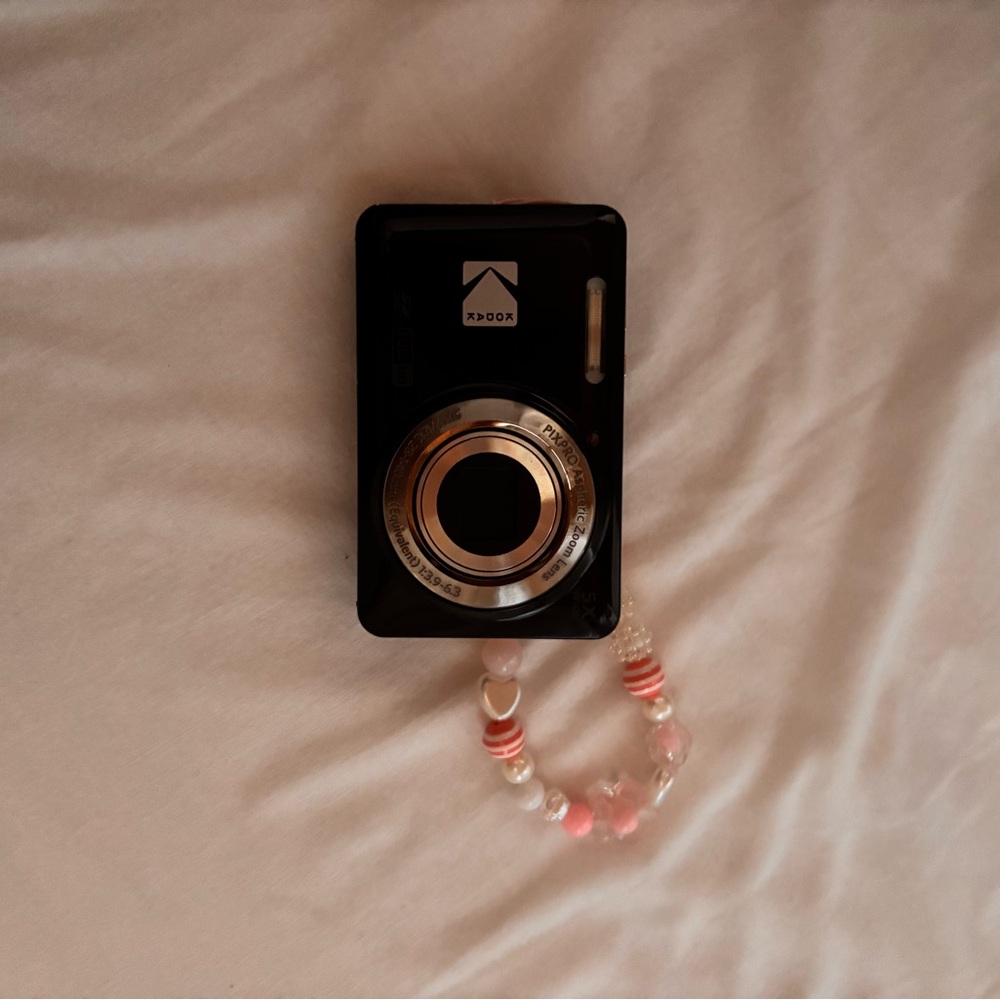 Black Digital Camera with Pink Beaded Strap